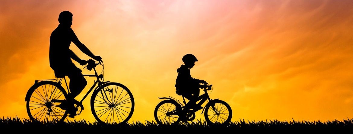 father_and_son_biking_at_sunset