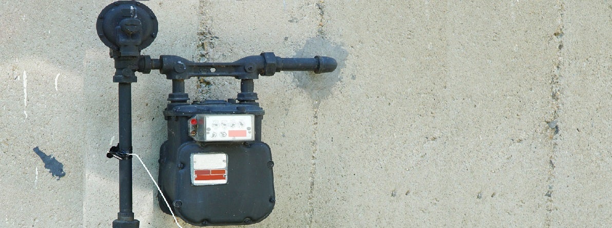 A dramatic landscape of a stormy sky with vivid lightning strikes over a dark, sprawling cityscape at dusk, with an ominous and powerful atmosphere.