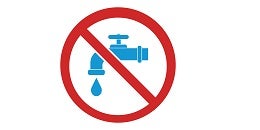 A blue faucet dripping water is crossed out with a red prohibition symbol. This signifies water conservation or a ban on water usage.