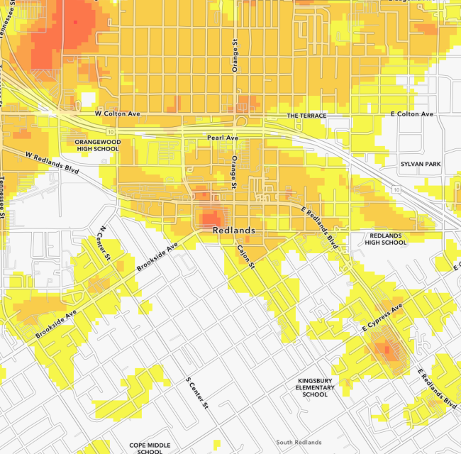 A map of Redlands, California, displays varying intensity of heat, with red and orange areas indicating higher temperatures and yellow areas indicating lower temperatures.