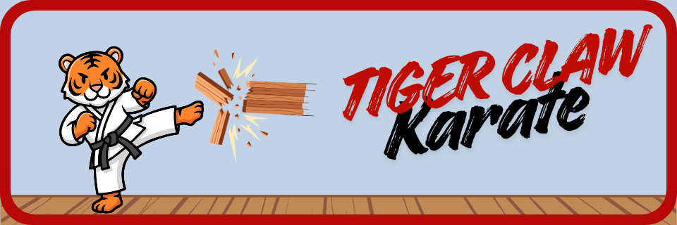 Cartoon tiger in a karate uniform breaks wooden boards with a kick next to the text "TIGER CLAW Karate" on a light blue background with a wood floor.